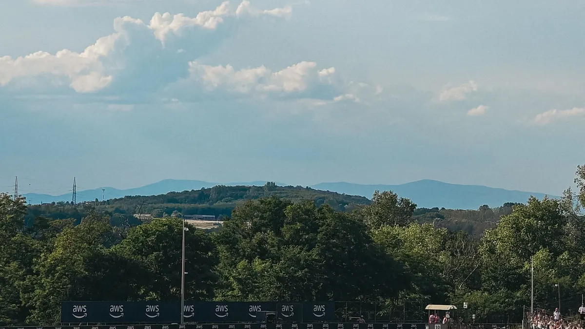 Spectators watching a motorsport event from a grandstand