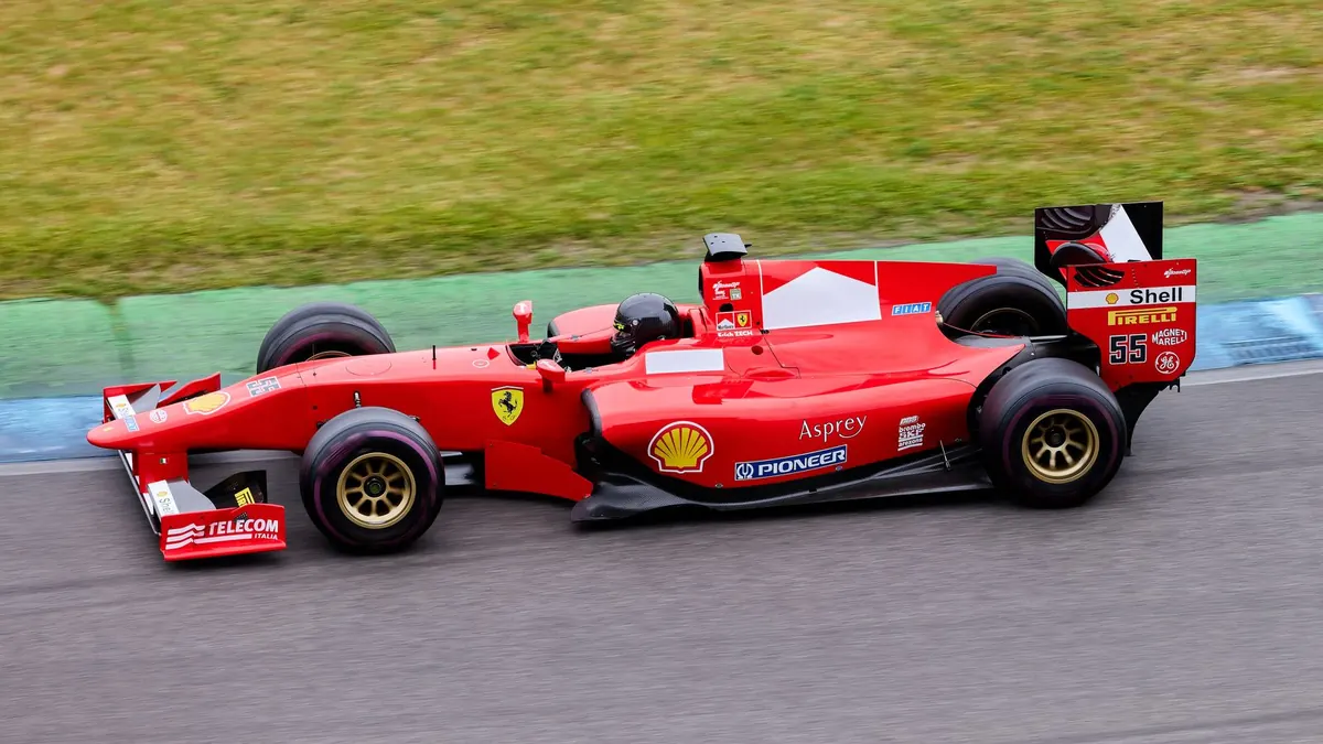A racing car at speed on a circuit
