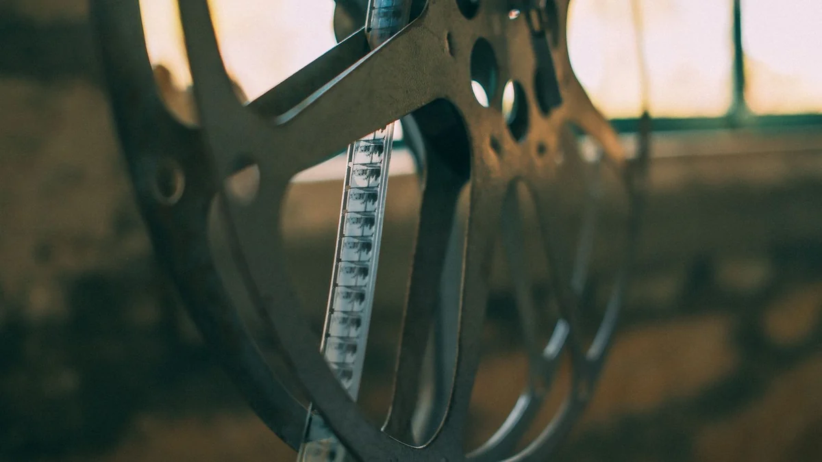 A vintage film reel resting in soft light