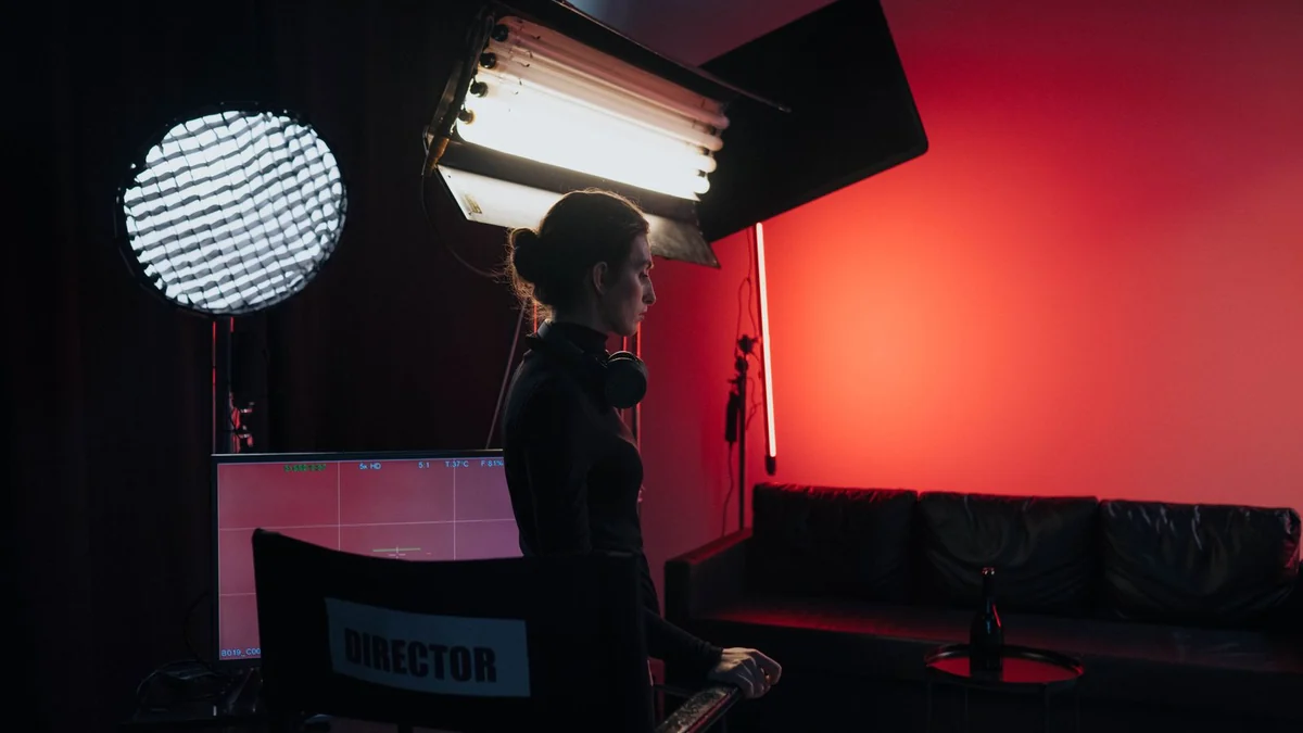 A director's chair on a dimly lit film set