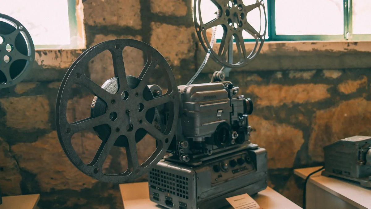 A classic film projector in a rustic room
