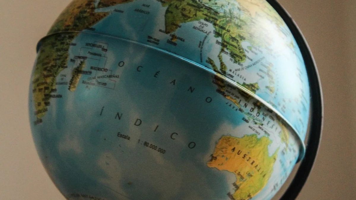A vintage world globe on a wooden stand