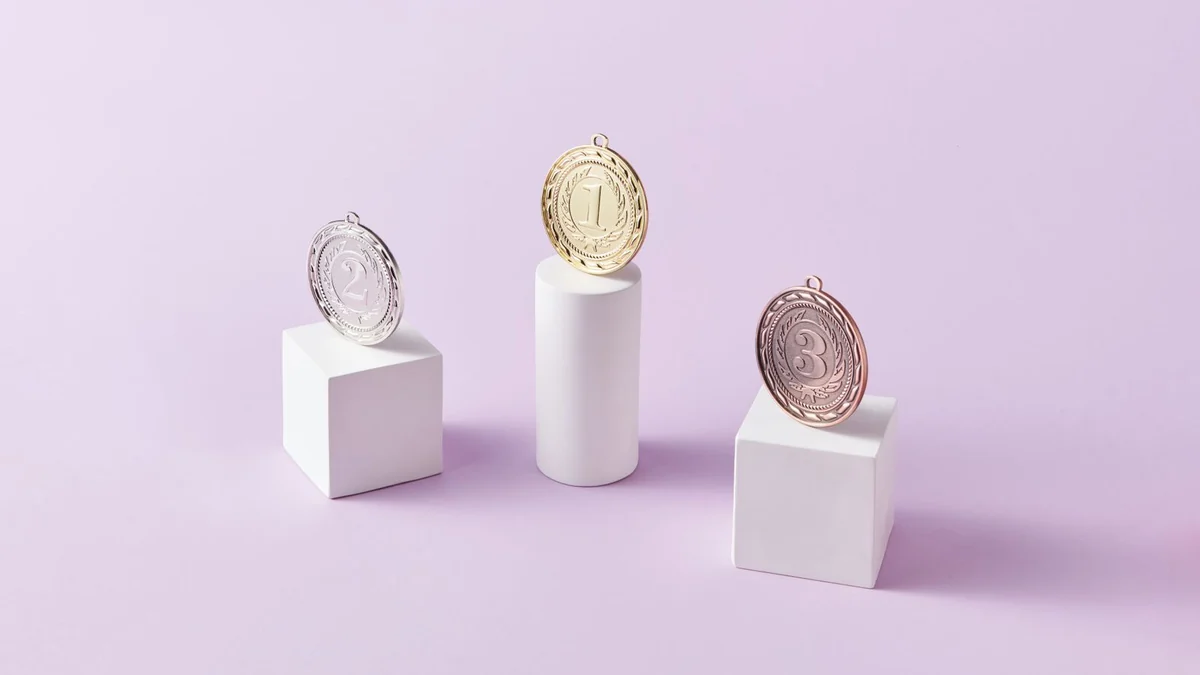 Three medals arranged on podium blocks for first, second and third place