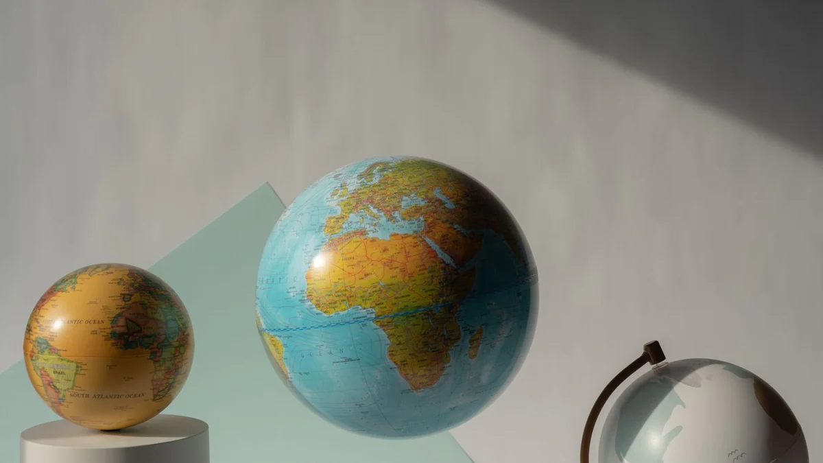 Several world globes arranged in a studio setting